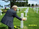 Red Rivers '47 Visit to Normandy with Gold Star Platoon List - Supervisor rubs damp sand from the beach to make words stand out